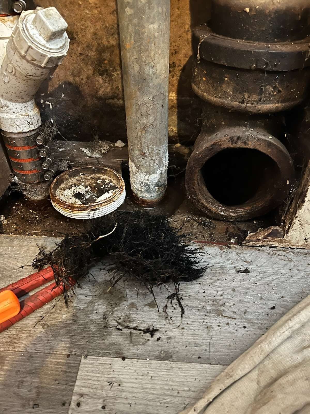 Plumbing repair — drain cleanout